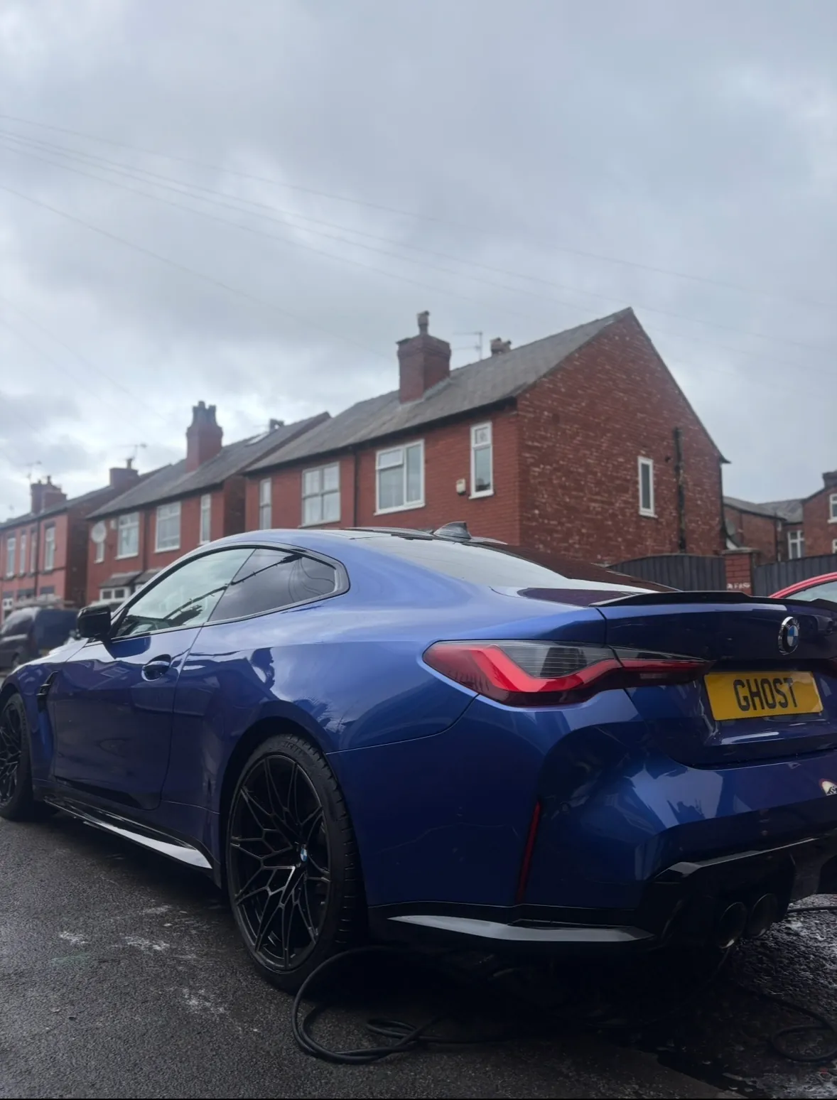 Blue BMW M4 viewed from the rear