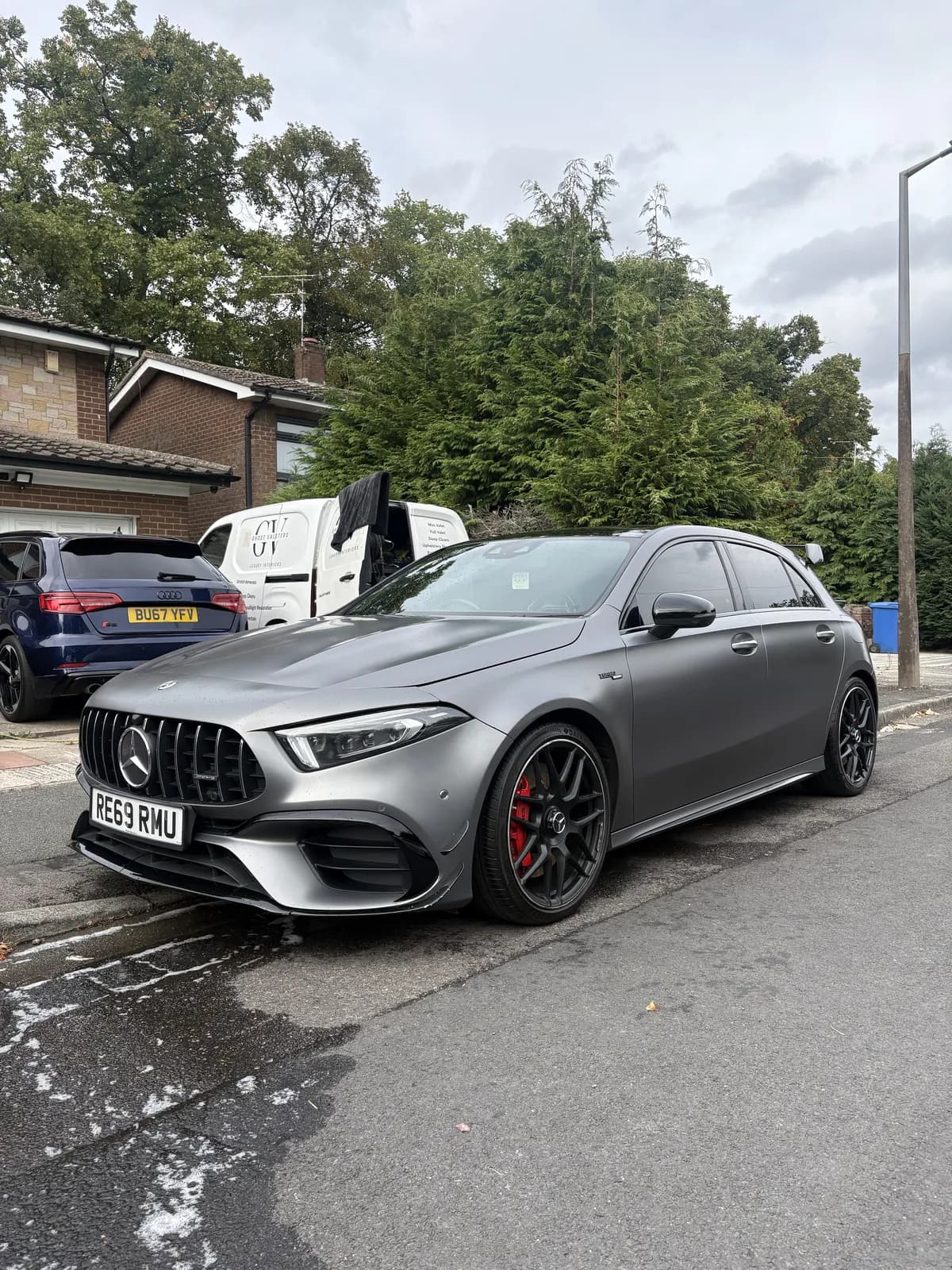 Grey Mercedes-AMG beside the Ghost Valeters mobile van