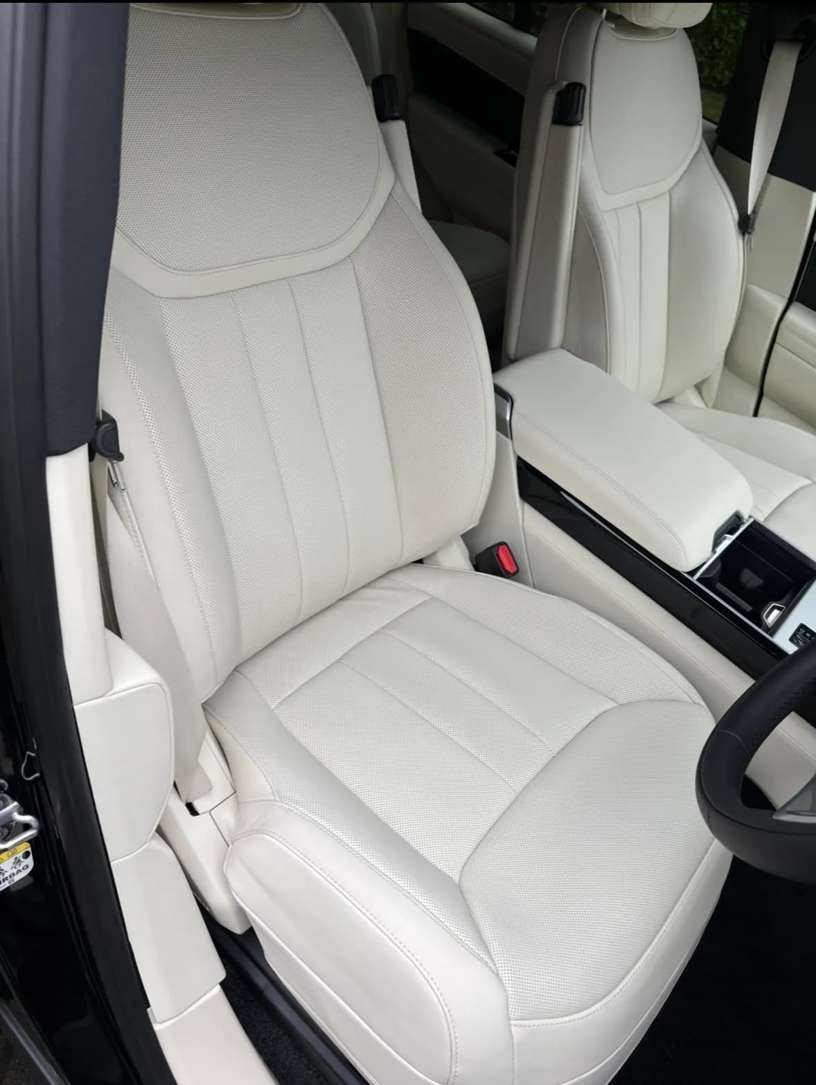 White leather seats and centre console in a Range Rover